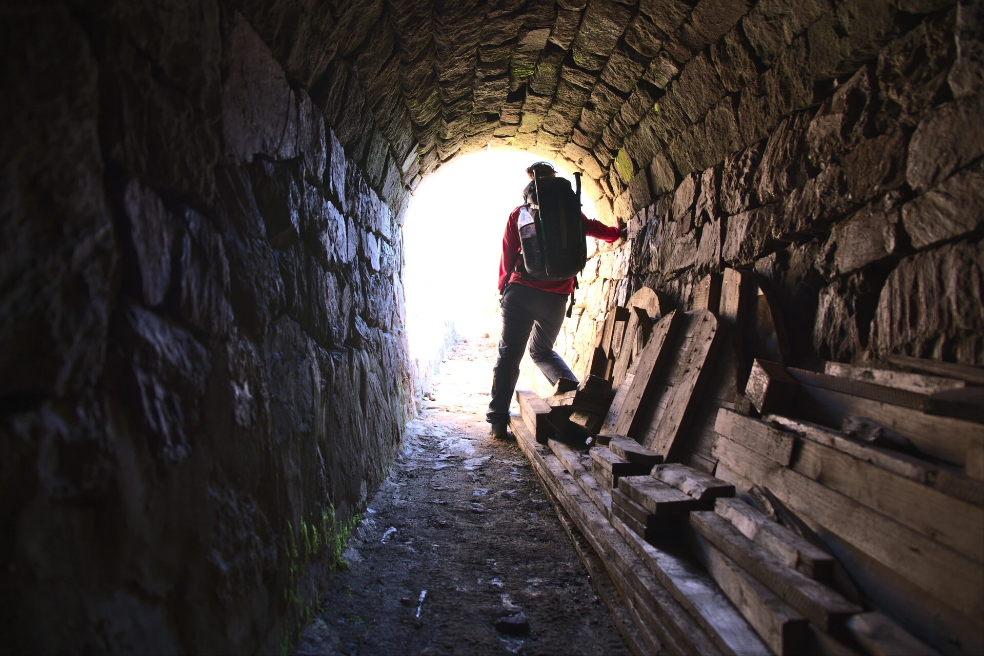 Hillwalker in a stone-built gallery of the canal de Malcros