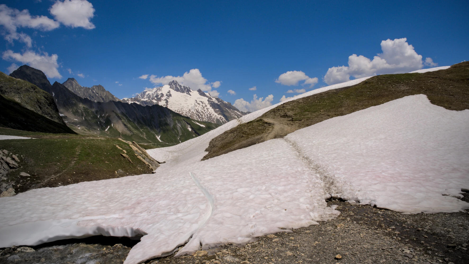 Snow still wide across the path, col de la Seigne area early in the season